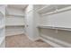 Spacious walk-in closet with double hanging rods and shelving at 110 Mohave Dr, Louisburg, NC 27549