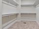 Large walk-in closet with built-in shelving and hanging rods at 110 Mohave Dr, Louisburg, NC 27549