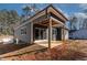 Gray house exterior with a covered patio at 110 Mohave Dr, Louisburg, NC 27549