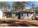 Gray house exterior with a covered patio at 110 Mohave Dr, Louisburg, NC 27549