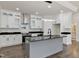 Modern kitchen with white cabinets, granite counters, and island at 110 Mohave Dr, Louisburg, NC 27549