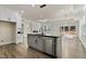 Modern kitchen island with stainless steel appliances and breakfast bar at 110 Mohave Dr, Louisburg, NC 27549