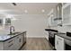 Modern kitchen with white cabinets, granite counters, and island at 110 Mohave Dr, Louisburg, NC 27549