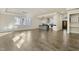 Spacious open-concept featuring hardwood floors, leading into a kitchen area with a gray island at 110 Mohave Dr, Louisburg, NC 27549