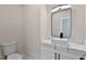 Small powder room with floating vanity and marble countertop at 110 Mohave Dr, Louisburg, NC 27549