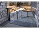 Stone steps leading to the front door, with a modern metal railing at 110 Mohave Dr, Louisburg, NC 27549