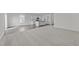 Open concept kitchen and living room with vinyl plank and carpet flooring at 148 Babbling Brook Dr, Clayton, NC 27520
