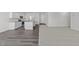 Open concept kitchen and living room with vinyl plank and carpet flooring at 148 Babbling Brook Dr, Clayton, NC 27520