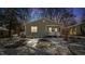 House exterior at dusk, snowy yard at 1512 Morning Glory Ave, Durham, NC 27703