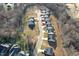 Aerial view of a residential neighborhood with houses and tree-lined streets at 1975 Meadowview Dr, Graham, NC 27253