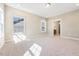 Neutral bedroom with soft carpet, bright windows, and convenient ensuite bathroom access at 1975 Meadowview Dr, Graham, NC 27253