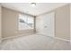 Comfortable bedroom with a large window offering natural light and a double door closet at 1975 Meadowview Dr, Graham, NC 27253