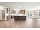 Modern kitchen with an island, stainless steel appliances, ample cabinet space, and stylish pendant lighting at 1975 Meadowview Dr, Graham, NC 27253