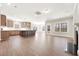 Spacious open-concept living room featuring hardwood floors, neutral walls, and an abundance of natural light at 1975 Meadowview Dr, Graham, NC 27253