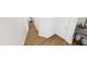 Hallway with hardwood floors, white trim, and doorways leading to various rooms, connecting different areas at 290 Beacon Dr, Pittsboro, NC 27312