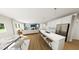 Open-concept living area with a modern kitchen, dining space, and cozy living room, perfect for entertaining at 290 Beacon Dr, Pittsboro, NC 27312