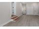 Finished basement with laminate flooring and ample storage space at 3305 Victor Pl, Raleigh, NC 27604