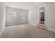 Finished basement with laminate flooring and an exterior door at 3305 Victor Pl, Raleigh, NC 27604