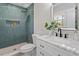 Modern bathroom features stylish tiled shower, sleek vanity, and a large mirror at 3305 Victor Pl, Raleigh, NC 27604