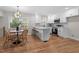 Bright dining area with a chandelier and wicker chairs at 3305 Victor Pl, Raleigh, NC 27604