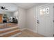 Inviting entryway with hardwood floors and a view into the living room at 3305 Victor Pl, Raleigh, NC 27604