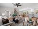 Bright living room features hardwood floors, comfy seating, and a view into the kitchen and dining area at 3305 Victor Pl, Raleigh, NC 27604