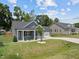 Gray house next to tan house with green lawn at 36 Mae Ct, Roxboro, NC 27573