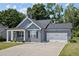 Gray house with a two-car garage and porch at 36 Mae Ct, Roxboro, NC 27573