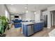Open concept kitchen with blue island and stainless steel appliances at 36 Mae Ct, Roxboro, NC 27573