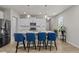 Kitchen island with blue seating and granite countertop at 36 Mae Ct, Roxboro, NC 27573