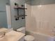 Bathroom features a shower and tub combination with modern fixtures, shelving and lighting at 4202 Cherry Blossom Cir, Durham, NC 27713