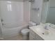 Bright bathroom features a tub and shower combination with vanity and modern fixtures at 4202 Cherry Blossom Cir, Durham, NC 27713