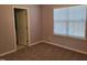 Bedroom with neutral paint, carpet flooring, and natural light at 4202 Cherry Blossom Cir, Durham, NC 27713