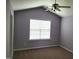 Bedroom with vaulted ceiling, neutral paint, carpet flooring, and a window with blinds at 4202 Cherry Blossom Cir, Durham, NC 27713