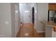 Inviting entryway with hardwood floors, white trim, arched doorway, and a view of the staircase at 4202 Cherry Blossom Cir, Durham, NC 27713