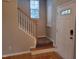Welcoming entryway features wood floors, staircase and a white front door with sidelight at 4202 Cherry Blossom Cir, Durham, NC 27713