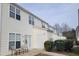 Rear exterior view of townhomes with patio and outdoor seating area at 4202 Cherry Blossom Cir, Durham, NC 27713