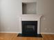 Fireplace with white mantle and decorative trim with a black hearth at 4202 Cherry Blossom Cir, Durham, NC 27713