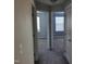 Hallway view to two carpeted bedrooms with windows bringing in natural light at 4202 Cherry Blossom Cir, Durham, NC 27713