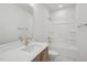 Bright bathroom featuring a shower-tub combo, white countertops, and bronze fixtures at 4717 Cypress Tree Ln, Raleigh, NC 27612