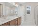 Bright bathroom boasts double sinks, sleek fixtures, and a glass-enclosed shower at 4717 Cypress Tree Ln, Raleigh, NC 27612