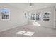 Spacious bedroom features plush carpeting and multiple windows for ample natural light at 4717 Cypress Tree Ln, Raleigh, NC 27612