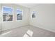 Well lit bedroom with three windows offering neighborhood views at 4717 Cypress Tree Ln, Raleigh, NC 27612