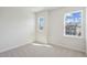 Well lit bedroom with two windows offering neighborhood views at 4717 Cypress Tree Ln, Raleigh, NC 27612