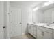 Double vanity bathroom with white cabinets and tile flooring at 501 Hanover Shore Ln, Raleigh, NC 27610