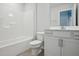 Bathroom features a shower/tub combo, white vanity, and tile floor at 501 Hanover Shore Ln, Raleigh, NC 27610