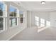 Bright bedroom with large windows and plush carpeting at 501 Hanover Shore Ln, Raleigh, NC 27610