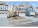 Two-story home with neutral siding and a two-car garage at 501 Hanover Shore Ln, Raleigh, NC 27610