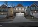 Two-story home with neutral siding, two-car garage, illuminated at night at 501 Hanover Shore Ln, Raleigh, NC 27610