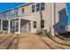 Rear exterior view showing screened porch and yard at 501 Hanover Shore Ln, Raleigh, NC 27610